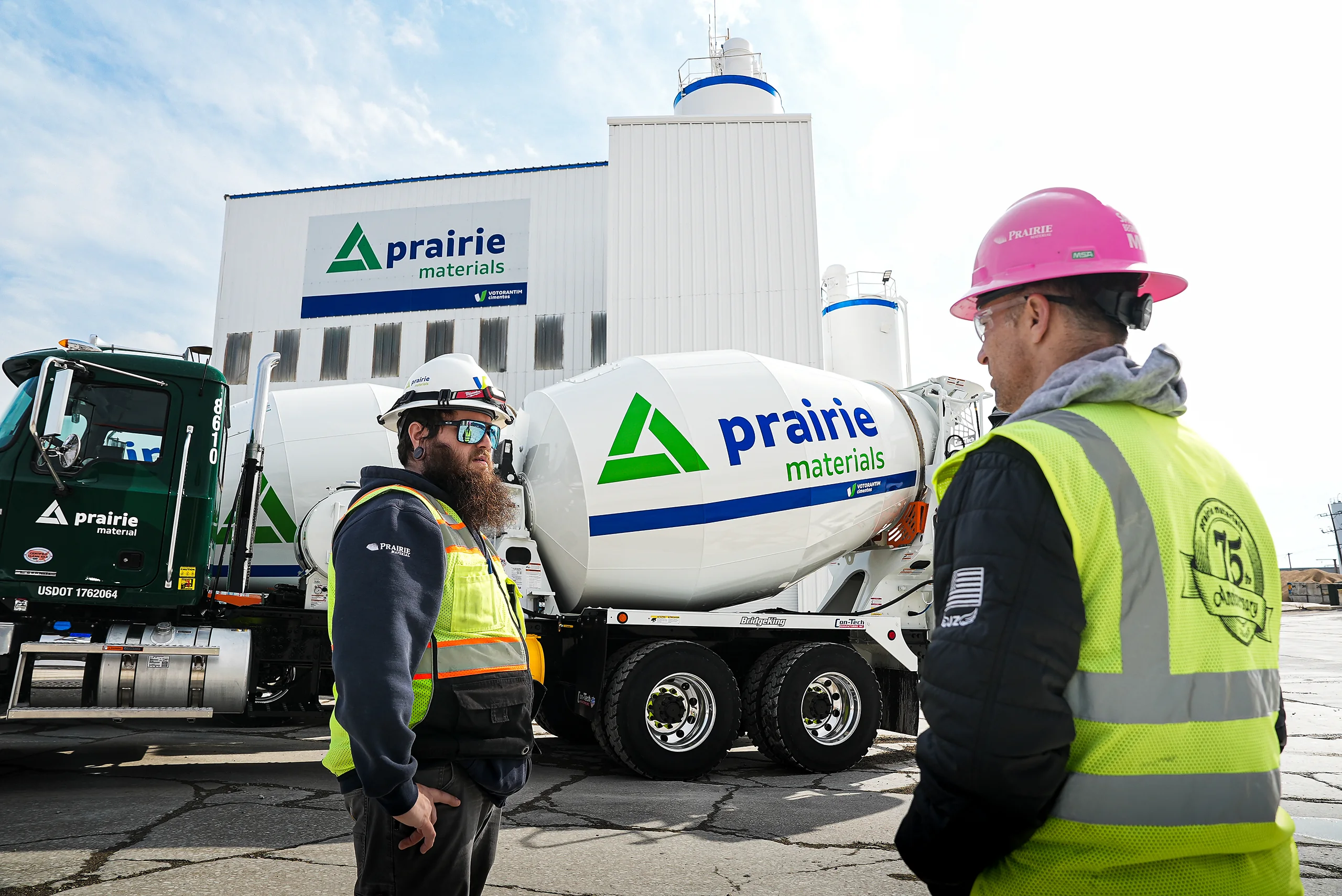 Building Materials Supplier - workers beside a Prairie Materials mixer truck at a Prairie Materials plant