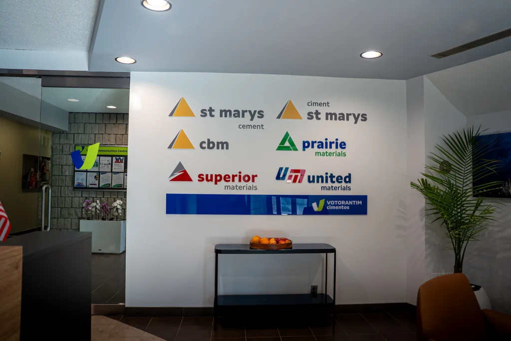 Cement and Concrete Solutions - lobby wall with the St Marys, CBM, Prairie, Superior, United and Votorantim Cimentos logos