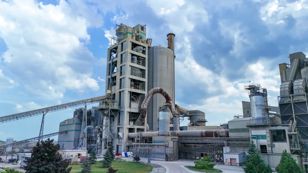 Regional Cement Suppliers - St Marys Cement plant with its preheater tower and conveyors under a blue sky