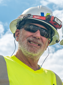 Careers at VCNA - Chuck Gould, Ready-mix Driver at Prairie Materials, in a hard hat and safety vest